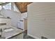 Bright bathroom featuring a double vanity, laundry area, and wood paneled ceiling at 180 Willow Lake Ln, Sharpsburg, GA 30277