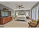 Spacious bedroom features neutral tones, soft carpeting, and a large window at 180 Willow Lake Ln, Sharpsburg, GA 30277