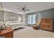 Bedroom features cozy decor, plush carpeting, and natural light at 180 Willow Lake Ln, Sharpsburg, GA 30277