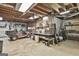 Spacious garage features concrete floor, work table and a golf cart for easy transportation around the property at 180 Willow Lake Ln, Sharpsburg, GA 30277