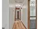 Hallway with wood floors and view of bathroom at 180 Willow Lake Ln, Sharpsburg, GA 30277
