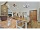 The spacious living room features a stone fireplace, hardwood floors, and a comfortable seating area at 180 Willow Lake Ln, Sharpsburg, GA 30277