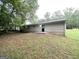 Large backyard with mature trees, a patio, and vinyl siding at 221 Courthouse Park Dr, Temple, GA 30179