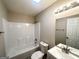 Clean bathroom featuring a shower-tub combo, white vanity, and modern lighting at 221 Courthouse Park Dr, Temple, GA 30179