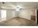 Spacious carpeted bedroom with a ceiling fan, adjoining bathroom, and ample space at 221 Courthouse Park Dr, Temple, GA 30179