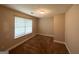Cozy bedroom with neutral carpet, a window with blinds, and a standard ceiling light at 221 Courthouse Park Dr, Temple, GA 30179