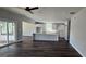 Open-concept kitchen features a central island with a marble countertop and white shaker cabinets at 1378 Gus Thornhill Jr Dr, East Point, GA 30344