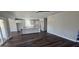 Open-concept living space featuring a central island with a marble countertop and modern wooden floors at 1378 Gus Thornhill Jr Dr, East Point, GA 30344