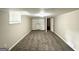 Basement with built-in shelves, carpet flooring, and a bright, natural light at 1814 Mary Lou Se Ln, Atlanta, GA 30316