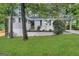 Charming single-story home with light colored brick and a well-maintained front lawn at 1814 Mary Lou Se Ln, Atlanta, GA 30316