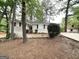 Inviting single-story home with light colored brick, well-kept garden and a driveway at 1814 Mary Lou Se Ln, Atlanta, GA 30316