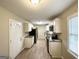 Well-lit kitchen with stainless steel appliances, granite countertops, and white cabinets at 1814 Mary Lou Se Ln, Atlanta, GA 30316