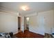 Well lit bedroom features hardwood floors and ensuite bathroom access at 4511 Ravenwood Pl # 70, Union City, GA 30291