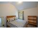 Bright bedroom features high ceilings, a wooden bedframe, and a modern dresser at 4511 Ravenwood Pl # 70, Union City, GA 30291