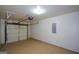 Garage interior showing garage door and opener with epoxy flooring at 4511 Ravenwood Pl # 70, Union City, GA 30291