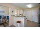 Cozy kitchen bar with granite countertops and a view to the living room, perfect for casual dining at 4511 Ravenwood Pl # 70, Union City, GA 30291