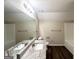 Well-lit bathroom features a granite vanity top, modern sink fixtures, and wood-look flooring at 6861 John Clark Dr, Douglasville, GA 30134