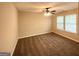 Comfortable bedroom with natural light, a ceiling fan, and neutral carpet at 6861 John Clark Dr, Douglasville, GA 30134