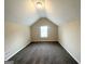Cozy bedroom with neutral paint and carpet, featuring a window and recessed lighting at 6861 John Clark Dr, Douglasville, GA 30134