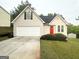 Charming single-Gathering home with a well-maintained lawn and attached two-car garage at 6861 John Clark Dr, Douglasville, GA 30134