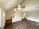Open concept living room with hardwood floors, staircase and neutral paint colors at 6861 John Clark Dr, Douglasville, GA 30134