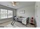 Neutral bedroom with a modern ceiling fan and gray ladder bed at 7575 Old Camp Lndg, Cumming, GA 30040