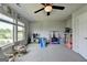 Spacious bonus room featuring a ceiling fan, plush carpet, and lots of natural light at 7575 Old Camp Lndg, Cumming, GA 30040