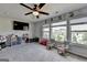 Bright bonus room with a ceiling fan, big windows, and plush carpet at 7575 Old Camp Lndg, Cumming, GA 30040