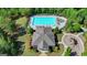 An aerial view showcases a large community pool, clubhouse, playground, and meticulously landscaped grounds at 7575 Old Camp Lndg, Cumming, GA 30040