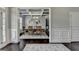 Elegant dining room featuring stylish mirrors and a coffered ceiling, adjacent to foyer at 7575 Old Camp Lndg, Cumming, GA 30040