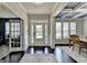 Inviting foyer with dark hardwood floors and a bright entryway, with beautiful ceiling design at 7575 Old Camp Lndg, Cumming, GA 30040