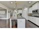 Contemporary kitchen featuring a central island and sleek cabinetry at 7575 Old Camp Lndg, Cumming, GA 30040