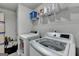 Bright laundry room featuring a modern washer and dryer at 7575 Old Camp Lndg, Cumming, GA 30040