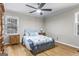 Cozy bedroom with hardwood floors, large window, and comfortable bed at 1680 Huntington Dr, Marietta, GA 30066