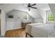 Bright upstairs bedroom features hardwood floors and natural light at 1680 Huntington Dr, Marietta, GA 30066