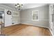 Elegant dining room with gleaming hardwood floors, neutral paint, and ample natural light at 1680 Huntington Dr, Marietta, GA 30066
