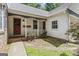 Charming home featuring double doors, a covered porch and well maintained landscaping at 1680 Huntington Dr, Marietta, GA 30066