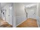 Spacious hallway featuring gleaming hardwood floors and detailed trim work throughout at 1680 Huntington Dr, Marietta, GA 30066