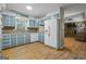 Bright kitchen features blue cabinets, wood floors, and stainless steel appliances at 1680 Huntington Dr, Marietta, GA 30066