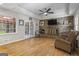 Open living room with brick fireplace, hardwood floors, and natural light at 1680 Huntington Dr, Marietta, GA 30066