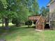 Backyard with spacious wooden deck and steps, perfect for outdoor entertaining at 3725 Concord Rd, Newborn, GA 30056