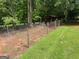 Fenced backyard with mature trees at 3725 Concord Rd, Newborn, GA 30056
