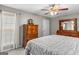 Bedroom with a large bed, dresser, and a window overlooking the front yard at 3725 Concord Rd, Newborn, GA 30056