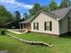 This home features nice landscaping and a convenient carport at 3725 Concord Rd, Newborn, GA 30056