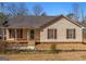 Traditional home with neutral siding, shuttered windows, and a welcoming front porch at 3725 Concord Rd, Newborn, GA 30056