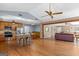Spacious open-concept kitchen features stainless appliances, granite counters, island, and hardwood flooring at 3725 Concord Rd, Newborn, GA 30056