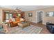 Comfortable living room with hardwood floors, fireplace, and lots of natural light at 3725 Concord Rd, Newborn, GA 30056