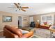 Cozy living room with hardwood floors, fireplace, comfortable seating, and ample natural light at 3725 Concord Rd, Newborn, GA 30056