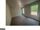 This bedroom has two windows for natural light and plush gray carpeting at 35 Emerald Ln # 14, Covington, GA 30014