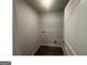 Efficient laundry room with shelving and hookups for washer and dryer at 35 Emerald Ln # 14, Covington, GA 30014